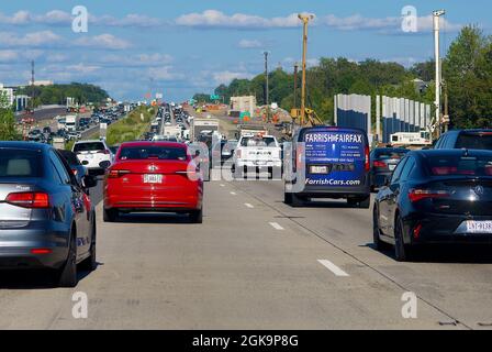 Fairfax County, Virginia, USA - September 3, 2021: Traffic moves slowly through heavy congestion on Interstate 66 (I-66) in a construction zone. Stock Photo