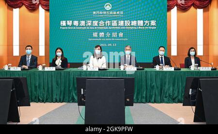 (210914) -- MACAO, Sept. 14, 2021 (Xinhua) -- Cheong Weng Chon (3rd R), secretary for administration and justice of the Macao Special Administrative Region (SAR) government, and Ao Ieong U (4th R), secretary for social affairs and culture, attend a press conference in Macao, south China, on Sept. 13, 2021. Institutional innovation and rule of law are vital to the steady and sustained development of the Guangdong-Macao in-depth cooperation zone in Hengqin, the Macao SAR government said Monday. The central authorities earlier this month made public a general plan of building the Guangdong-Maca Stock Photo