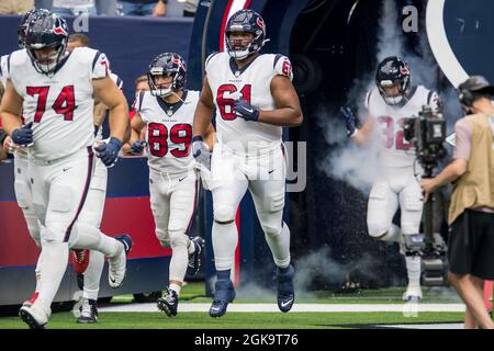 Houston Texans offensive tackle Marcus Cannon 61 recovers a