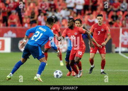 Toronto, Canada, September 8, 2021: Junior Hoilett, No.10, of Team Canada in action against two players of Team El Salvador (blue) during the CONCACAF World Cup Qualifying 2022 match at BMO Field in Toronto, Canada. Canada won the match 3-0. Stock Photo