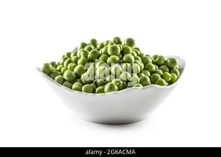 Fresh Green peas in white bowl isolated on white background. Stock Photo