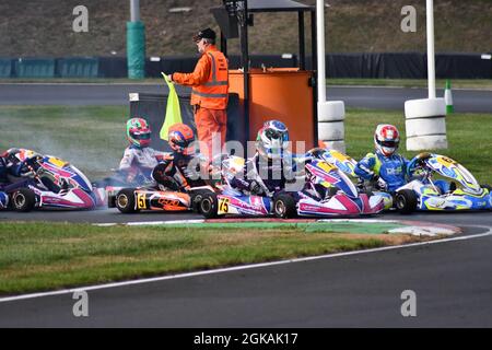 Action during a go kart race on a circuit specifically designed for go karting in the UK Stock Photo