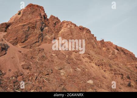 Image of rock cliff with red stones in the desert Stock Photo