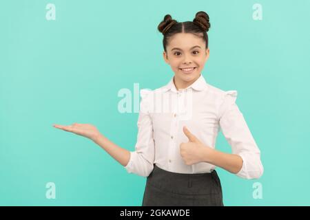 Shopping at its best. Happy child give thumbs up showing open hand. Shopping like never before Stock Photo