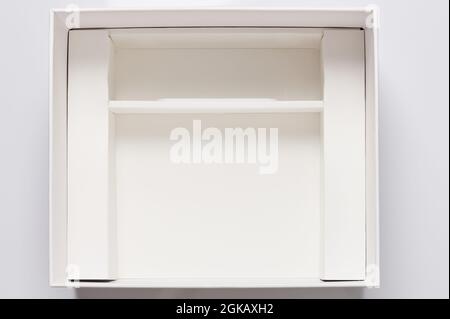 Open white box with compartment  isolated above top view Stock Photo