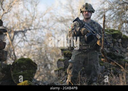 US Soldiers assigned to the 1st Armored Brigade Combat Team, 1st Cavalry Division rests after the final battle during Combined Resolve XV, March 1, 2021 at the Hohenfels Training Area. Combined Resolve XV allows allies and partners to connect – personally, professionally, technically, and tactically – to create stronger, more capable forces during times of crisis. Stock Photo