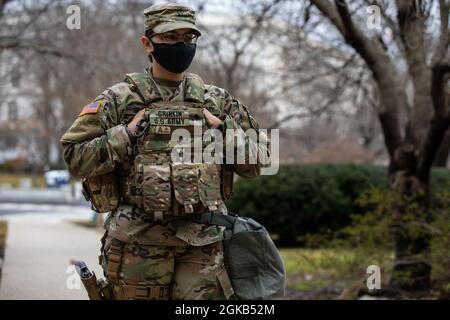 U.S. Army Spc. Briana Grinkin, a military police officer with the 508th Military Police Company, New Jersey National Guard, stands watch near the U.S. Capitol in Washington, March 1, 2021. The National Guard has been requested to continue supporting federal law enforcement agencies with security, communications, medical evacuation, logistics, and safety support to district, state, and federal agencies through mid-March. Stock Photo