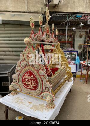 Devotees of Imam Hussain are holding mourning procession in connection of 10th Muharram-ul-Haram, passing through Mehfil e shah e Khurasan Karachi Stock Photo