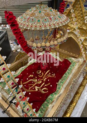 Devotees of Imam Hussain are holding mourning procession in connection of 10th Muharram-ul-Haram, passing through Mehfil e shah e Khurasan Karachi Stock Photo