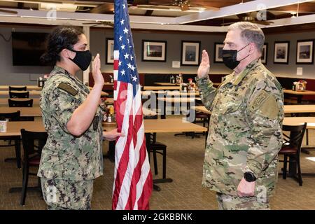 SILVERDALE, Wash. (March 3, 2021) – Chairman of the Joint Chiefs of Staff Gen. Mark A. Milley reenlists USS Michigan (SSGN 727) Gold crew Fire Control Technician 2nd Class Karie Davis, from Minneapolis, Minnesota, March 3. Milley also toured Trident Training Facility Bangor, Strategic Weapons Facility Pacific and the Ohio-class ballistic-missile submarine USS Alabama (SSBN 731) while visiting strategic-deterrent units in the Pacific Northwest. Stock Photo