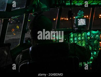 U.S. Air Force Lt. Col. Joseph Bennington, C-130 Hercules pilot, 386th Air Expeditionary Wing, prepares for takeoff at Ali Al Salem Air Base, Kuwait, March 3, 2021. The C-130 aircraft supported U.S. Air Forces Central in a multi-day event that enhanced overall combat competencies and integrated joint and regional partners across the area of responsibility. Stock Photo