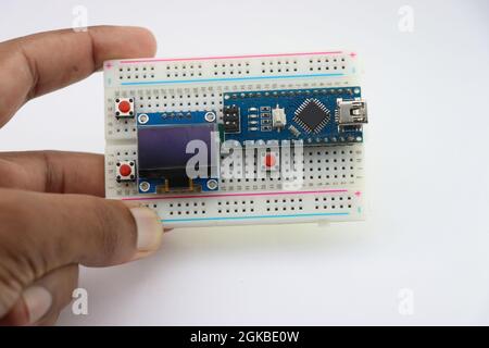 Microcontroller and OLED display project development, breadboard circuit for prototyping creative projects for engineers Stock Photo