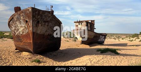 Boats in desert around Moynaq, Muynak or Moynoq - Aral sea or Aral lake - Uzbekistan - asia Stock Photo