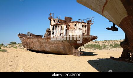 Boats in desert around Moynaq, Muynak or Moynoq - Aral sea or Aral lake - Uzbekistan - asia Stock Photo