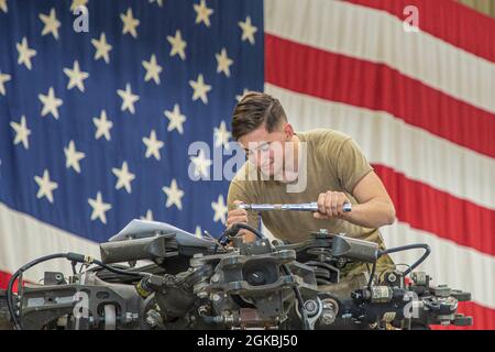 15T Blackhawk repairers assigned to 3rd Battalion, 25th Aviation Regiment, 25th Combat Aviation Brigade, 25th Infantry Division work daily to make sure maintenance gets done on the UH-60 Blackhawks on Wheeler Army Airfield, Hawaii. Stock Photo