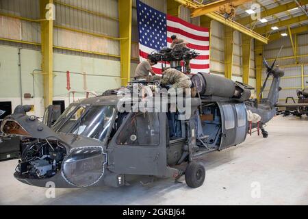 15T Blackhawk repairers assigned to 3rd Battalion, 25th Aviation Regiment, 25th Combat Aviation Brigade, 25th Infantry Division work daily to make sure maintenance gets done on the UH-60 Blackhawks on Wheeler Army Airfield, Hawaii. Stock Photo