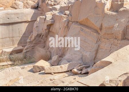 Pink granite quarry used in ancient Egypt for obelisk carving in the city of Aswan, Egypt Stock Photo