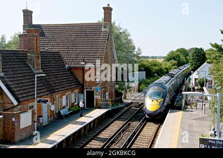 British Rail Class 395 'Javelin' passing the down platform at  Wye railway station in Kent, UK Stock Photo