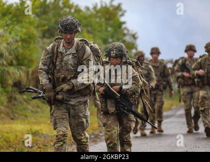 Soldiers with 1st Battalion, 27th Infantry Regiment, 2nd Infantry Brigade Combat Team, 25th Infantry Division, conduct a ruck march with a surprise leader's professional development event on March 5, 2021, at Schofield Barracks, Hawaii. Junior lieutenants across the battalion were originally told they had to ruck 6 miles, but were then flown to an undisclosed location on Schofield Barracks' East Range where they had to find their way back to the start point. Stock Photo