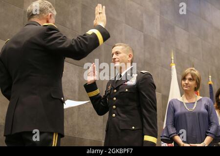 Maj. Gen. Jansen D. Boyles, adjutant general of Mississippi, swears in Col. (P) Michael Cleveland, commander of 66th Troop Command, during Cleveland's promotion at Camp Shelby Joint Forces Training Center, Mississippi, March 6, 2021. Cleveland recently took command of 66TC. Stock Photo