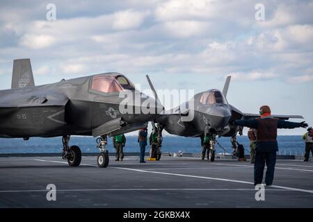 WESTERN ATLANTIC OCEAN (March 7, 2021) F-35B test pilots U.S. Marine Maj. Dylan Nicholas, BF-19, and British Royal Navy Lt. Cmdr. Barry Pilkington, BF-05, performs day envelope expansion test flights aboard Italian aircraft carrier ITS Cavour (CVH 550). The Air Test and Evaluation Squadron (VX) 23 pilots are embarked with the F-35 Patuxent River Integrated Test Force (ITF) for sea trials on the Italian Navy flagship in the Atlantic Ocean. Cavour is in phase one of its “Ready for Operations” campaign to certify its use of the fifth-generation fighter aircraft. Stock Photo