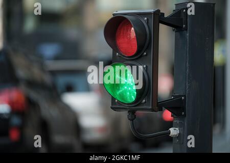 The green light is on at the two-color traffic light. Stock Photo