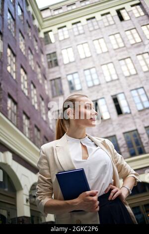 business woman going to work with notebook Stock Photo