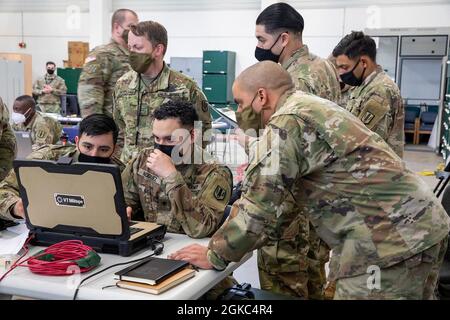 Soldiers from the 41st Field Artillery Brigade run through fire mission procedures during the Victory Glide command post exercise March 9, 2021, on Tower Barracks, Grafenwoehr, Germany. The exercise was the first step in the validation process for the staff of V Corps, which was reactivated on Oct. 16, 2020. Stock Photo