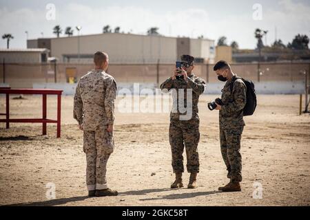 U.S. Marines assigned to Recruiting Station Oklahoma City, 9th Marine Corps District, interview a recruit assigned to Charlie Company, 1st Recruit Training Battalion, during the Marketing and Training Symposium at Marine Corps Recruit Depot San Diego, March 9, 2021. The Marketing and Training Symposium brought marketing and communication Marines from the Western Recruiting Region together to provide standardized training. Stock Photo