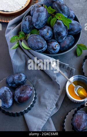 Preparing homemade plum crust, organic healthy dessert Stock Photo