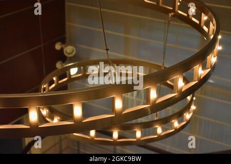 Two Big Glowing Chandeliers Close Up Stock Photo