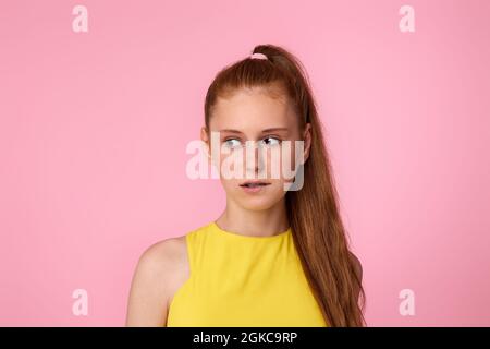 sad teen girl on green background. Human emotions Stock Photo