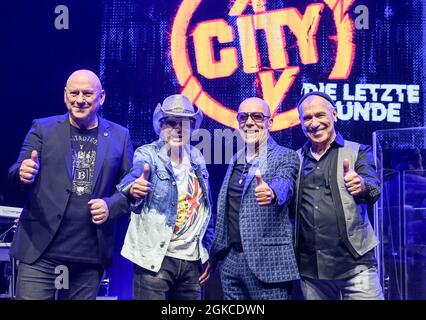 Berlin, Germany. 14th Sep, 2021. The musicians Manfred Hennig (l-r), Toni Krahl, Fritz Puppel and Georgi Gogow from the band City at a press event for the 50th anniversary in 2022. The band wants to say goodbye to their fans with several live concerts at the end of next year. A new double album and a book are planned for the anniversary year. Credit: Jens Kalaene/dpa-Zentralbild/dpa/Alamy Live News Stock Photo
