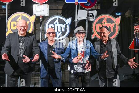 Berlin, Germany. 14th Sep, 2021. The musicians Manfred Hennig (l-r), Toni Krahl, Fritz Puppel and Georgi Gogow from the band City at a press event for the 50th anniversary in 2022 at the Kesselhaus. The band wants to say goodbye to their fans with several live concerts at the end of next year. A new double album and a book are planned for the anniversary year. Credit: Jens Kalaene/dpa-Zentralbild/dpa/Alamy Live News Stock Photo