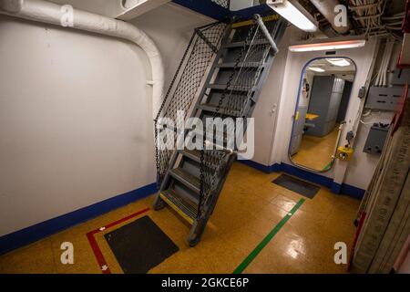 Ladder in the USS New Jersey (BB-62), Battleship New Jersey Museum & Memorial, berthed at Camden, N.J., March 11, 2021. The USS New Jersey, a 45,000-ton Iowa class battleship, was built at the Philadelphia Navy Yard, Pa. It was commissioned in May 1943 and served in the Pacific during World War II. The New Jersey was recommissioned in November 1950 for the Korean War and served two combat tours. The USS New Jersey was recalled to duty during the Vietnam War and recommissioned in April 1968. From then until April 1969, the New Jersey conducted frequent bombardments along the South Vietnamese co Stock Photo