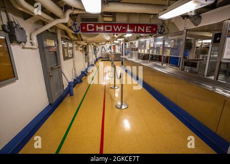 Chow-line (cafeteria) in the USS New Jersey (BB-62), Battleship New Jersey Museum & Memorial, berthed at Camden, N.J., March 11, 2021. The USS New Jersey, a 45,000-ton Iowa class battleship, was built at the Philadelphia Navy Yard, Pa. It was commissioned in May 1943 and served in the Pacific during World War II. The New Jersey was recommissioned in November 1950 for the Korean War and served two combat tours. The USS New Jersey was recalled to duty during the Vietnam War and recommissioned in April 1968. From then until April 1969, the New Jersey conducted frequent bombardments along the Sout Stock Photo