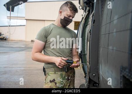 15T Blackhawk repairers assigned to 3rd Battalion, 25th Aviation Regiment, 25th Combat Aviation Brigade, 25th Infantry Division work daily to make sure maintenance gets done on the UH-60 Blackhawks on Wheeler Army Airfield, Hawaii. Stock Photo