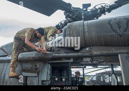 15T Blackhawk repairers assigned to 3rd Battalion, 25th Aviation Regiment, 25th Combat Aviation Brigade, 25th Infantry Division work daily to make sure maintenance gets done on the UH-60 Blackhawks on Wheeler Army Airfield, Hawaii. Stock Photo