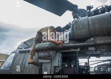 15T Blackhawk repairers assigned to 3rd Battalion, 25th Aviation Regiment, 25th Combat Aviation Brigade, 25th Infantry Division work daily to make sure maintenance gets done on the UH-60 Blackhawks on Wheeler Army Airfield, Hawaii. Stock Photo