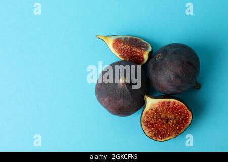 Fig on blue background, space for text Stock Photo