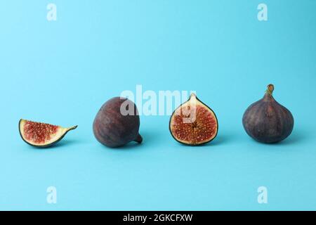 Fig on blue background, space for text Stock Photo