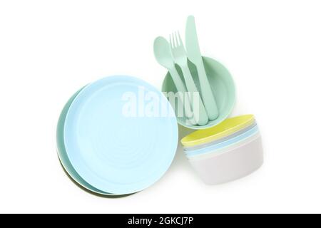 Colorful plastic dishware isolated on white background Stock Photo