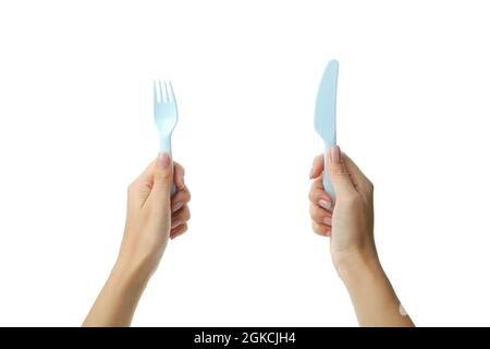 Female hands hold cutlery, isolated on white background Stock Photo