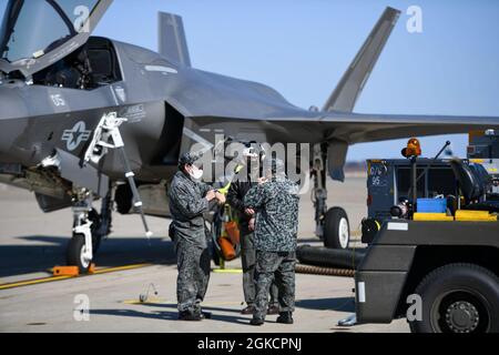 210315-N-EJ241-1025    MISAWA, Japan (March 15, 2021) – Capt. Anneliese Satz, a pilot assigned to the 'Green Knights' of Marine Fighter Attack Squadron (VMFA) 121, works with Japanese Air Self-Defence Force (JASDF) service members to perform maintenance on an F-35B Lightning II at Naval Air Facility (NAF) Misawa. NAF Misawa provides aviation and ground logistics support and services to all permanent and transient U.S. Navy and U.S. Marine Corps forces in Northern Japan. VMFA-121 is the first operational F-35 squadron in the U.S. military. Stock Photo