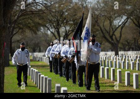 Members of the Fort Sam Houston Memorial Services Detachment processes to a funeral service at the Fort Sam Houston National Cemetery in San Antonio, Texas, March 15, 2021. This was the detachment’s 40,000th service at the cemetery. A small ceremony was held after the funeral to commemorate the detachment’s milestone. Stock Photo