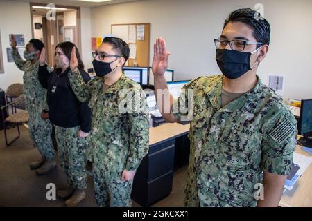 210316-N-RG482-0011 (March 16, 2021) BREMERTON, Wash. – Sailors from Navy Medicine Readiness and Training Command (NMRTC) Bremerton recite the oath of enlistment as part of the command’s extremism training stand down March 16, 2021. NMRTC Bremerton is conducting the training in small groups over a three-day period covering topics such as permissible and prohibited political activities, examples of unlawful participation in supremacist or extremist organizations, as well as permissible and recommended social media practices. Stock Photo