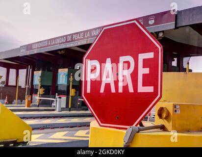 Lima, Peru - July 27, 2021: Close up of sign stating PARE (translated as STOP) at booth leaving Lima traveling north on the pan-american highway Stock Photo