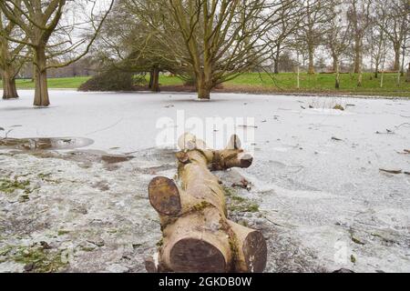 Frozen pond in Hyde Park during a very rare snowfall in the capital. London, United Kingdom 11 February 2021. Stock Photo