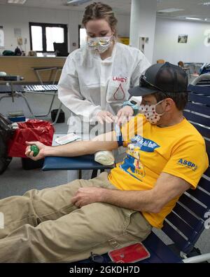 Chris Bowen, Red Cross Volunteer and Retiree, donates blood at the Armed Services Blood Program Europe blood drive in Wiesbaden at the lower Hainerberg shopping center on Monday, March 22. Service members and their families around the world depend on blood donors every day. Stock Photo