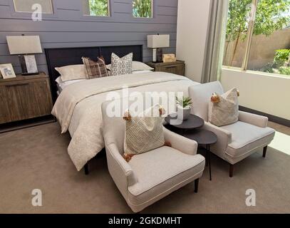 Master Bedroom With Two Arm Chairs Stock Photo
